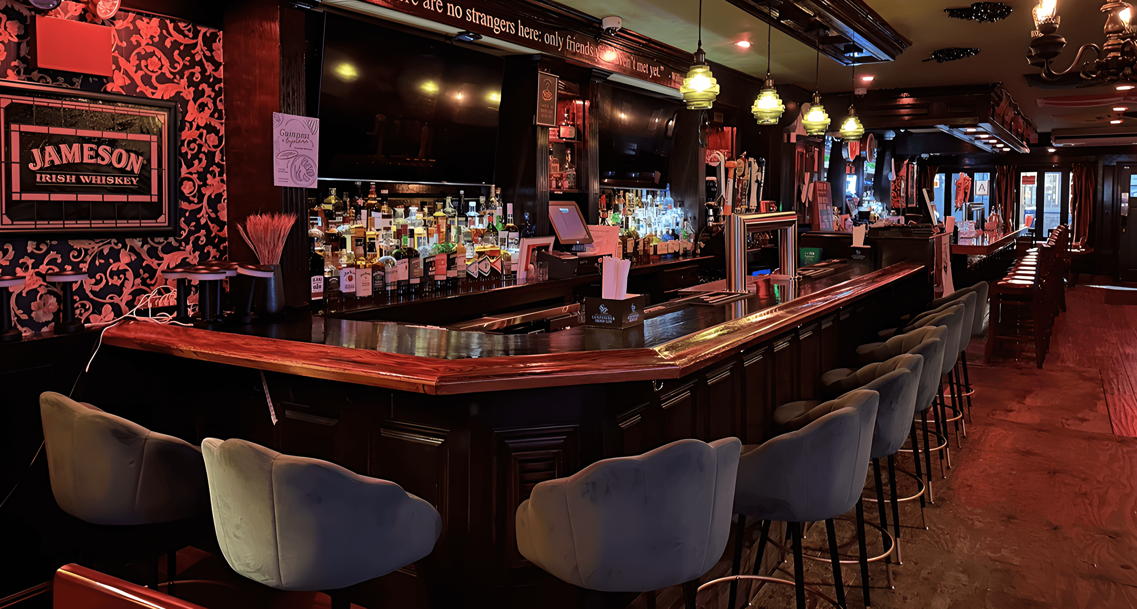 Interior of Wolfe Tone's Irish Pub with warm lighting, dark wood, and traditional Irish pub atmosphere
